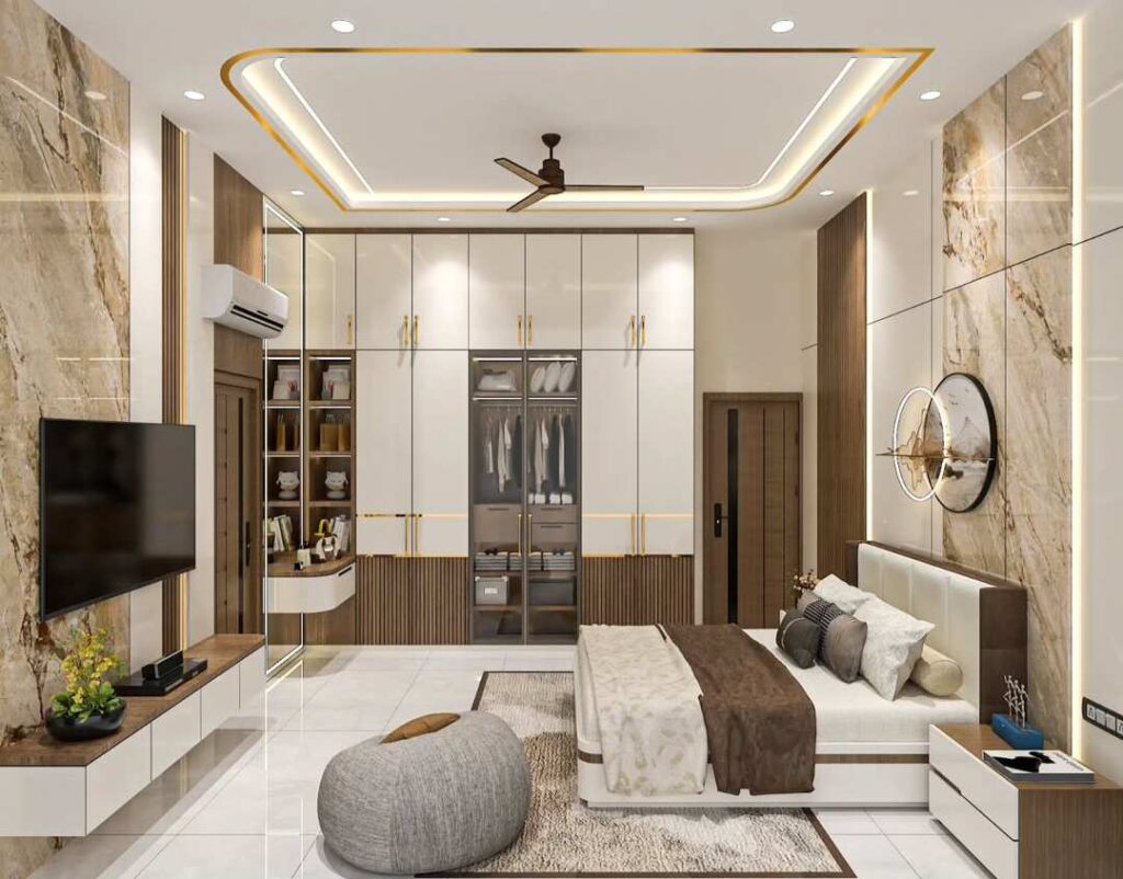 Modern bedroom with LED ceiling design, large wardrobe storage, marble wall panels, wall-mounted TV, and cozy bed setup.
